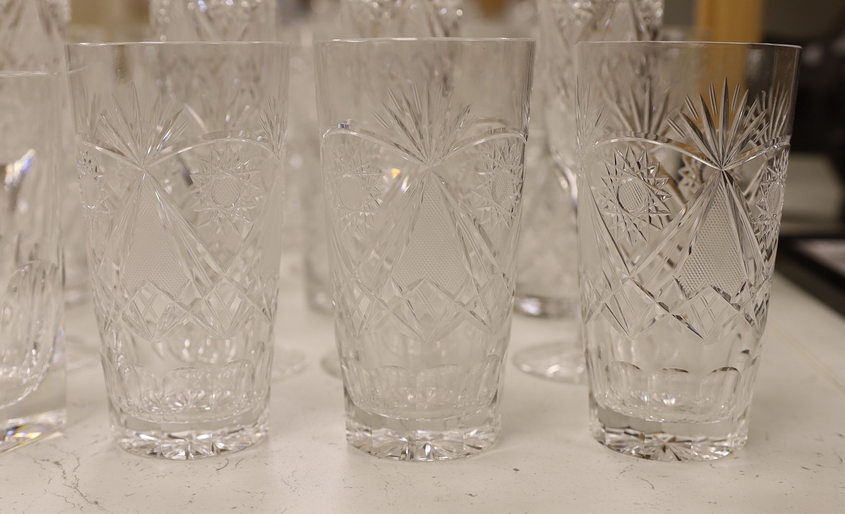 A suite of Hungarian cut drinking glassware, together with other glass